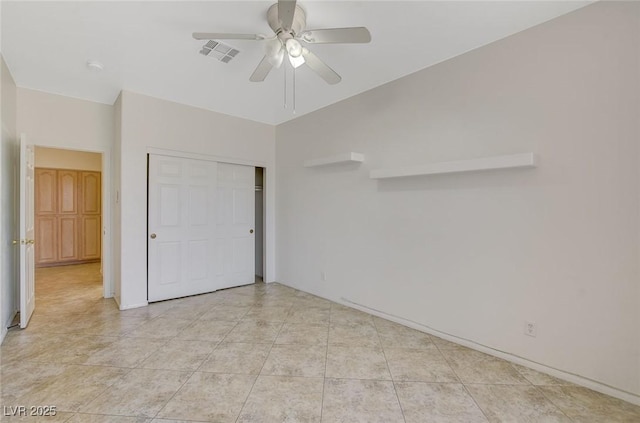 1408 Reebok Ter, Henderson, NV 89014 - unfurnished bedroom with a closet, a ceiling fan, and light tile patterned flooring