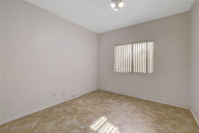 1408 Reebok Ter, Henderson, NV 89014 - spare room with light tile patterned floors and baseboards
