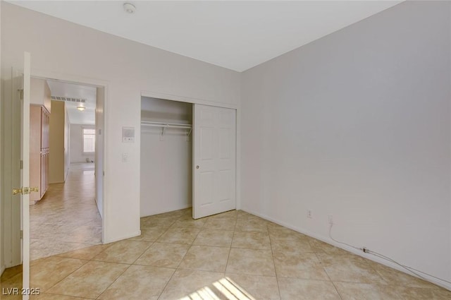 1408 Reebok Ter, Henderson, NV 89014 - unfurnished bedroom with light tile patterned floors and a closet
