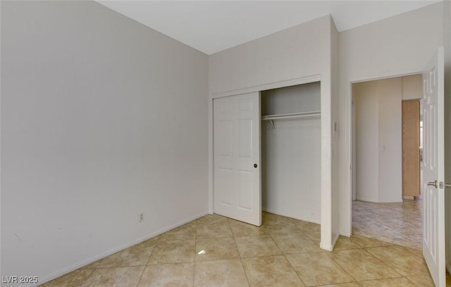 1408 Reebok Ter, Henderson, NV 89014 - unfurnished bedroom featuring light tile patterned floors, a closet, and baseboards