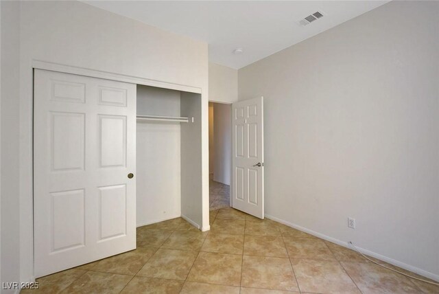 1408 Reebok Ter, Henderson, NV 89014 - unfurnished bedroom with a closet, light tile patterned floors, and baseboards