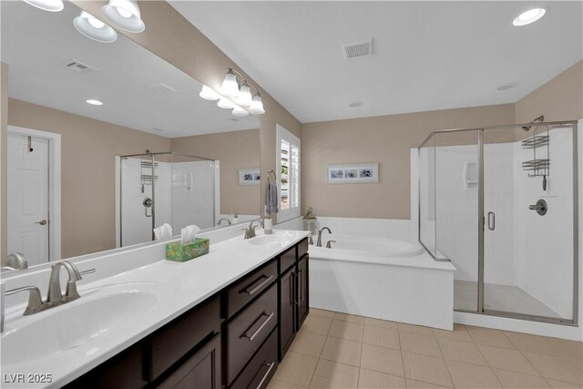 5542 Oak Bend Dr, Las Vegas, NV 89135 - bathroom with a stall shower, a garden tub, double vanity, and recessed lighting
