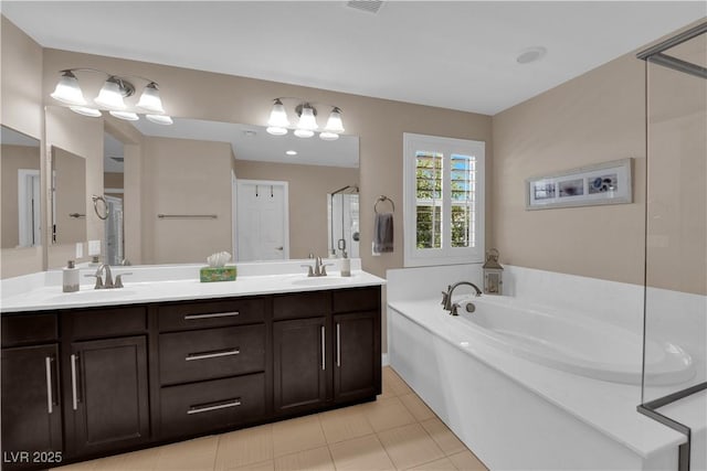 5542 Oak Bend Dr, Las Vegas, NV 89135 - full bath featuring double vanity, a garden tub, and tile patterned flooring