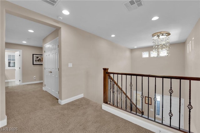 5542 Oak Bend Dr, Las Vegas, NV 89135 - hallway featuring an upstairs landing, carpet floors, recessed lighting, and a chandelier