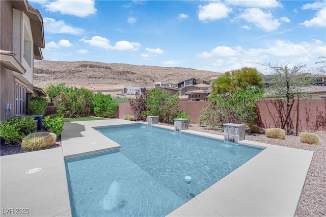 5542 Oak Bend Dr, Las Vegas, NV 89135 - view of swimming pool with a fenced backyard, a mountain view, and a patio