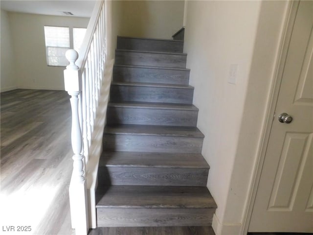 11173 Hickory Glen St, Las Vegas, NV 89179 - stairs featuring wood finished floors and baseboards