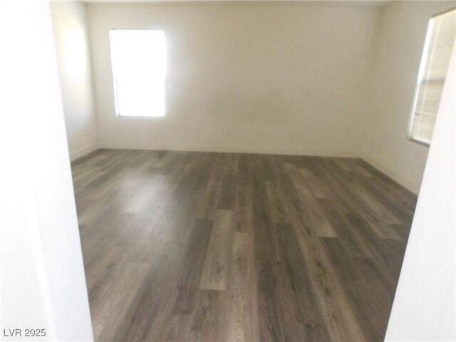 11173 Hickory Glen St, Las Vegas, NV 89179 - spare room with wood finished floors and baseboards
