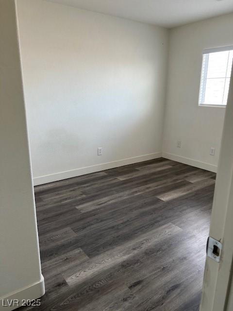 11173 Hickory Glen St, Las Vegas, NV 89179 - empty room featuring dark wood-type flooring and baseboards