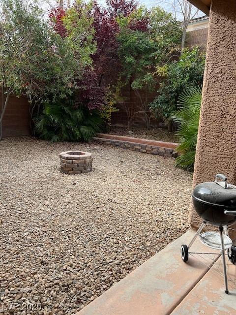 11173 Hickory Glen St, Las Vegas, NV 89179 - view of yard with an outdoor fire pit
