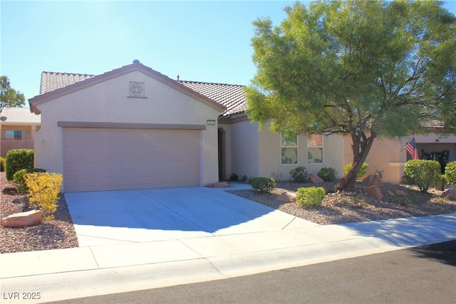 2212 Sawtooth Mountain Dr, Henderson, NV 89044 - mediterranean / spanish-style home with a garage, stucco siding, a tile roof, and concrete driveway