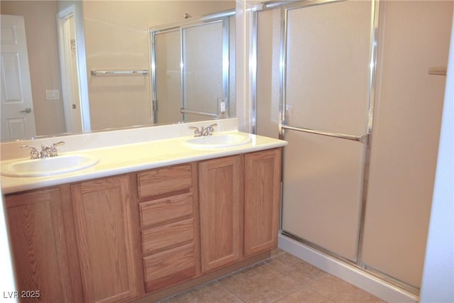 2212 Sawtooth Mountain Dr, Henderson, NV 89044 - bathroom with a shower stall, double vanity, and tile patterned floors