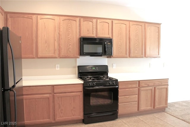 2212 Sawtooth Mountain Dr, Henderson, NV 89044 - kitchen with black appliances, light brown cabinetry, and light countertops