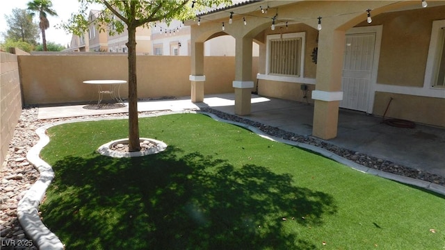 3606 Gold Sluice Ave, North Las Vegas, NV 89032 - fenced backyard with a patio