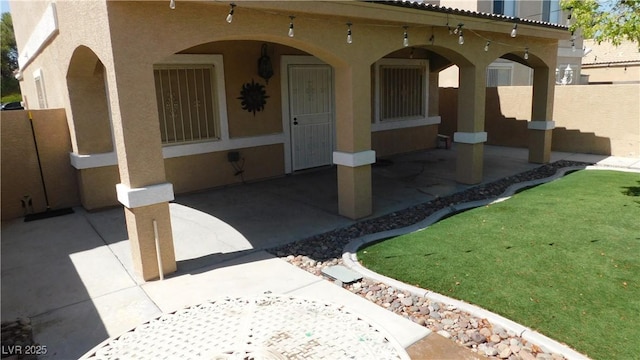 3606 Gold Sluice Ave, North Las Vegas, NV 89032 - property entrance with stucco siding and a patio