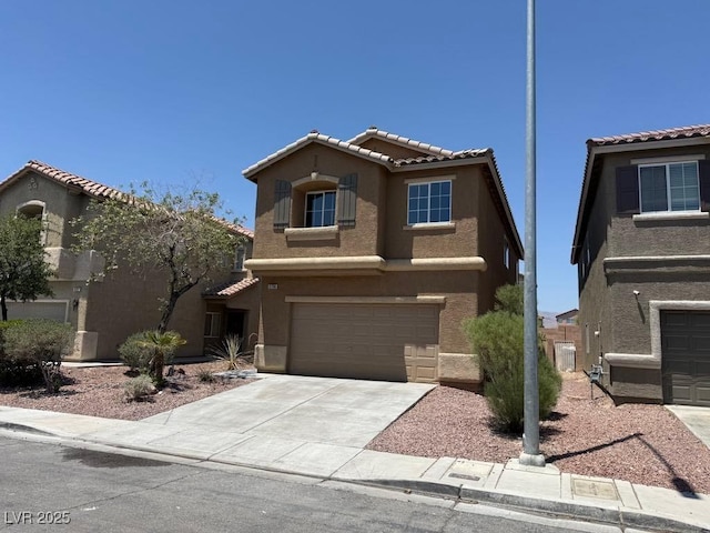 3736 Gallowtree Ave, North Las Vegas, NV 89081 - view of front of house with an attached garage, stucco siding, a tile roof, and driveway