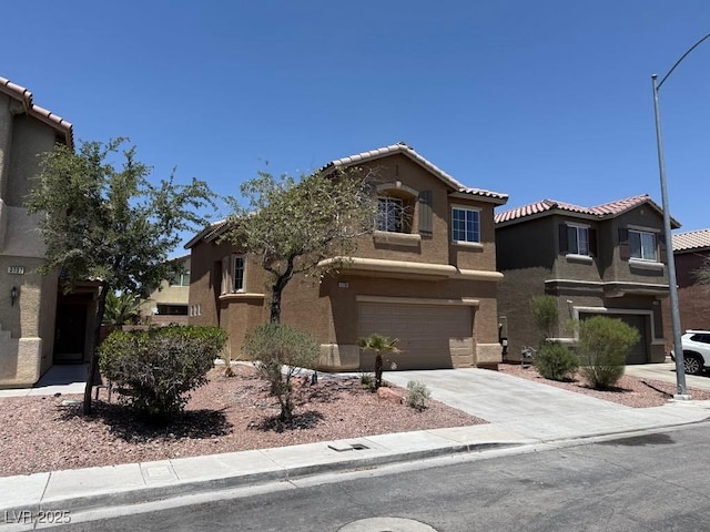 3736 Gallowtree Ave, North Las Vegas, NV 89081 - view of front of home featuring stucco siding, a garage, driveway, and a tile roof