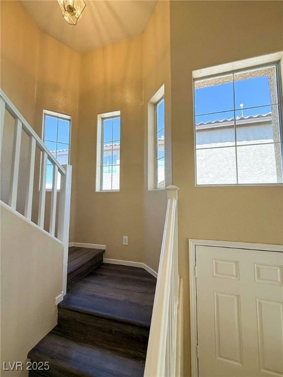 3736 Gallowtree Ave, North Las Vegas, NV 89081 - stairway featuring a towering ceiling and wood finished floors