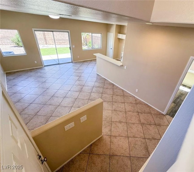 3736 Gallowtree Ave, North Las Vegas, NV 89081 - unfurnished room with light tile patterned floors and a textured ceiling