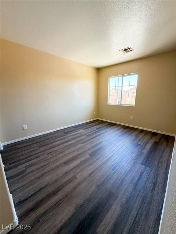 3736 Gallowtree Ave, North Las Vegas, NV 89081 - spare room with dark wood-style flooring and baseboards