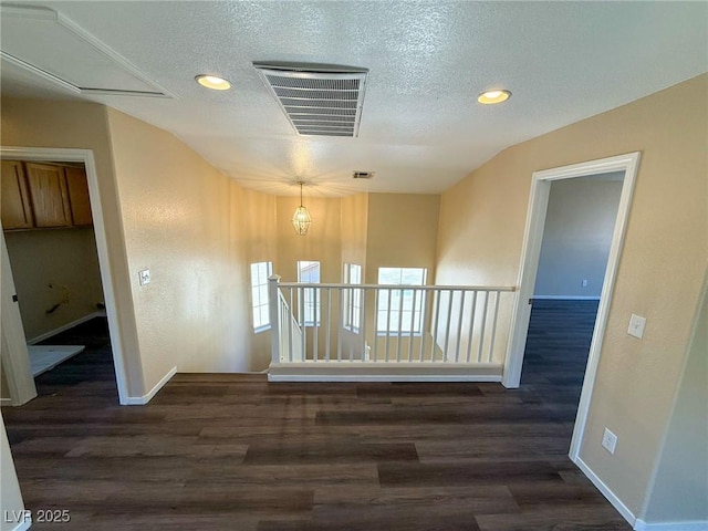 3736 Gallowtree Ave, North Las Vegas, NV 89081 - empty room featuring attic access, a textured ceiling, dark wood-type flooring, and recessed lighting