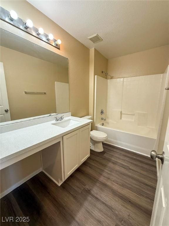 3736 Gallowtree Ave, North Las Vegas, NV 89081 - bathroom featuring wood finished floors, tub / shower combination, vanity, and a textured ceiling