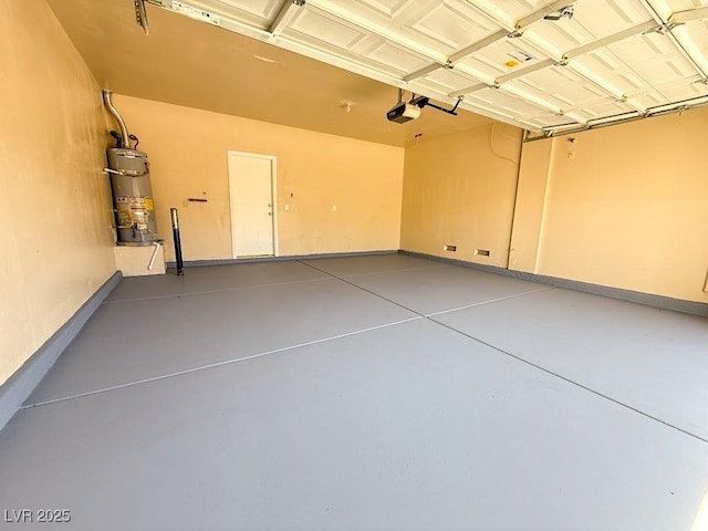 3736 Gallowtree Ave, North Las Vegas, NV 89081 - garage featuring strapped water heater and a garage door opener