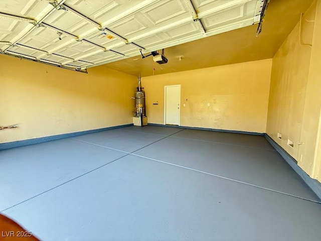 3736 Gallowtree Ave, North Las Vegas, NV 89081 - garage with strapped water heater and a garage door opener