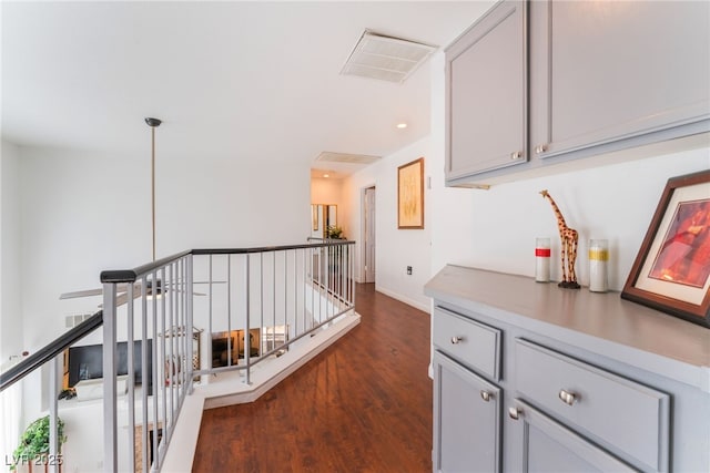 2789 Trotwood Ln, Las Vegas, NV 89108 - hall featuring an upstairs landing, dark wood-style flooring, baseboards, and recessed lighting
