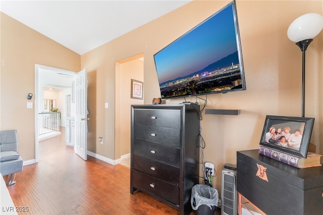 2789 Trotwood Ln, Las Vegas, NV 89108 - bedroom with wood finished floors, baseboards, and lofted ceiling