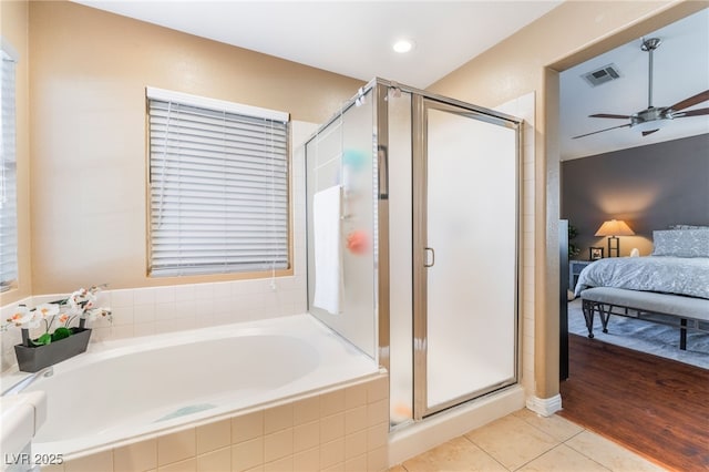 2789 Trotwood Ln, Las Vegas, NV 89108 - ensuite bathroom featuring a garden tub, a shower stall, ceiling fan, tile patterned floors, and recessed lighting