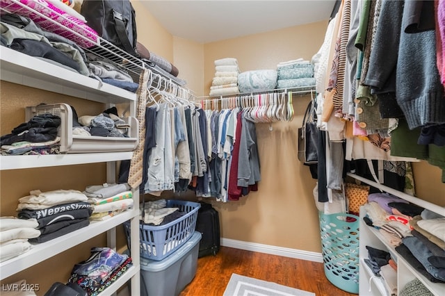 2789 Trotwood Ln, Las Vegas, NV 89108 - walk in closet featuring wood finished floors