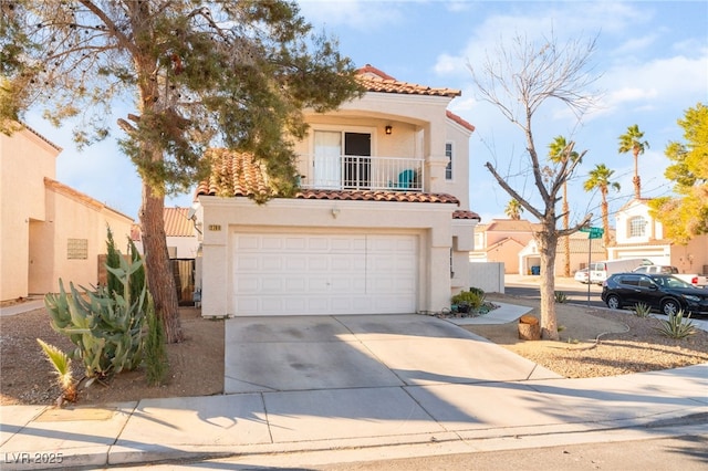 2789 Trotwood Ln, Las Vegas, NV 89108 - mediterranean / spanish home with a tiled roof, stucco siding, concrete driveway, and an attached garage