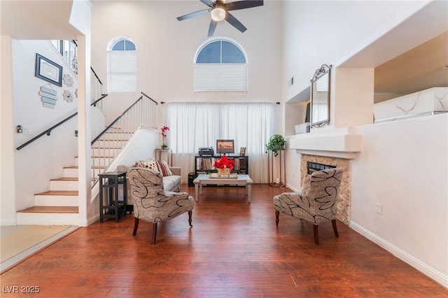 2789 Trotwood Ln, Las Vegas, NV 89108 - living area featuring a high ceiling, healthy amount of natural light, wood finished floors, and stairway