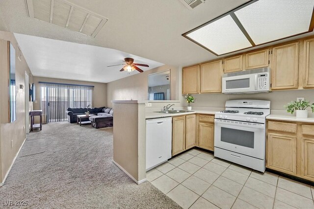 8070 W Russell Rd Unit 1036, Las Vegas, NV 89113 - kitchen with white appliances, light brown cabinets, and open floor plan
