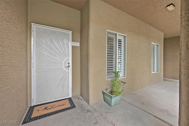 8070 W Russell Rd Unit 1036, Las Vegas, NV 89113 - property entrance featuring stucco siding and a patio
