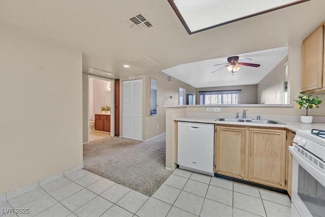 8070 W Russell Rd Unit 1036, Las Vegas, NV 89113 - kitchen featuring white appliances, a sink, light brown cabinetry, ceiling fan, and light countertops