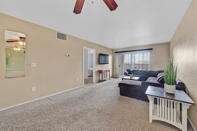 8070 W Russell Rd Unit 1036, Las Vegas, NV 89113 - living room with a ceiling fan, carpet flooring, and baseboards
