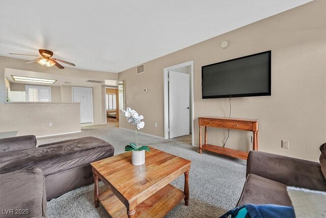 8070 W Russell Rd Unit 1036, Las Vegas, NV 89113 - living area featuring ceiling fan, light colored carpet, and baseboards