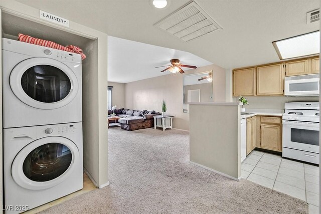 8070 W Russell Rd Unit 1036, Las Vegas, NV 89113 - laundry room with stacked washer and clothes dryer, light colored carpet, ceiling fan, and baseboards