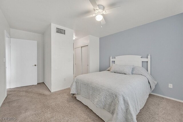8070 W Russell Rd Unit 1036, Las Vegas, NV 89113 - bedroom with light colored carpet, a closet, and baseboards