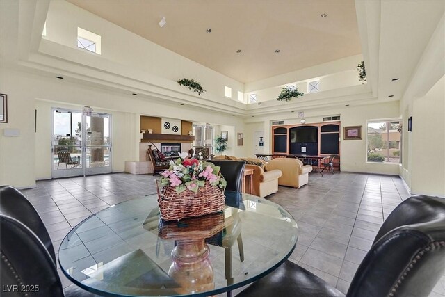 8070 W Russell Rd Unit 1036, Las Vegas, NV 89113 - dining space with tile patterned floors, plenty of natural light, a raised ceiling, and a towering ceiling