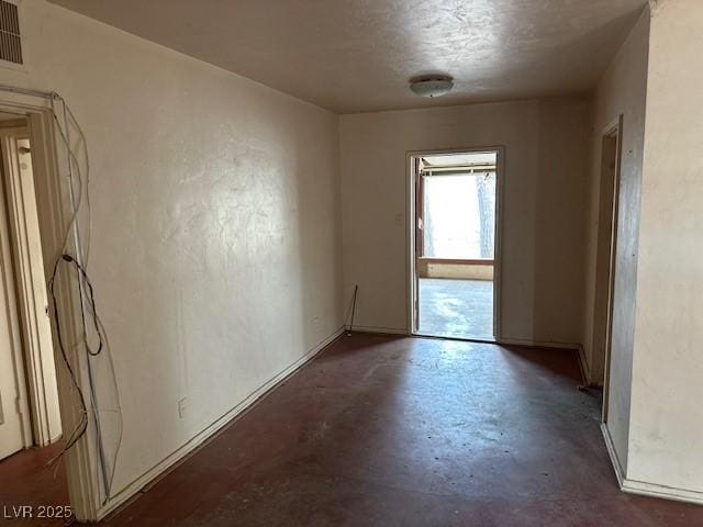 524 5th St, Boulder City, NV 89005 - spare room featuring concrete flooring and baseboards