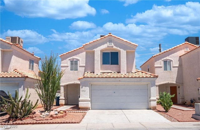 1436 Padre Bay Dr, Las Vegas, NV 89108 - mediterranean / spanish-style home featuring a tiled roof, driveway, stucco siding, and a garage