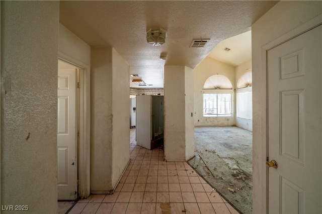 1436 Padre Bay Dr, Las Vegas, NV 89108 - hall featuring a textured ceiling and light tile patterned flooring