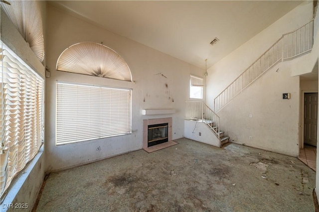 1436 Padre Bay Dr, Las Vegas, NV 89108 - unfurnished living room with a tile fireplace and stairway