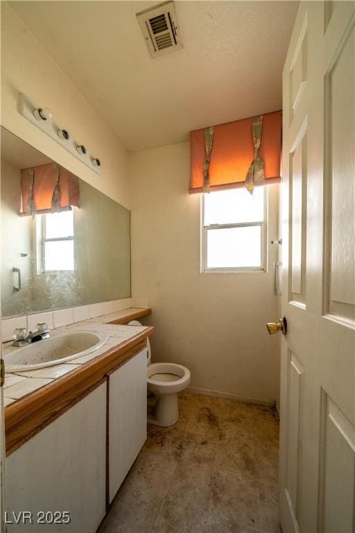 1436 Padre Bay Dr, Las Vegas, NV 89108 - bathroom featuring vanity, toilet, and baseboards