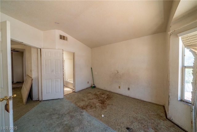 1436 Padre Bay Dr, Las Vegas, NV 89108 - unfurnished bedroom with lofted ceiling and carpet flooring