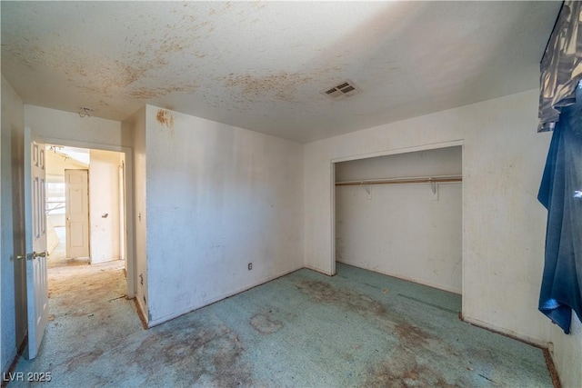 1436 Padre Bay Dr, Las Vegas, NV 89108 - unfurnished bedroom with carpet flooring, a closet, and a textured ceiling