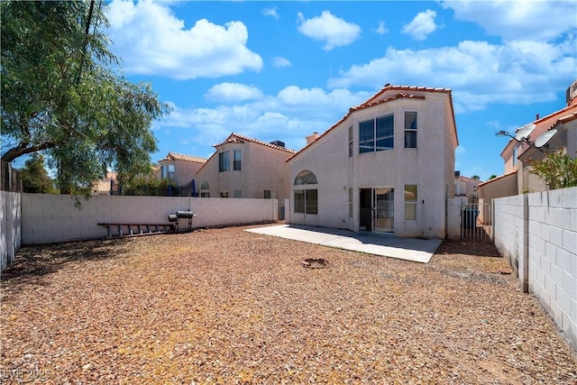 1436 Padre Bay Dr, Las Vegas, NV 89108 - back of property with stucco siding, a patio area, a fenced backyard, and a tile roof