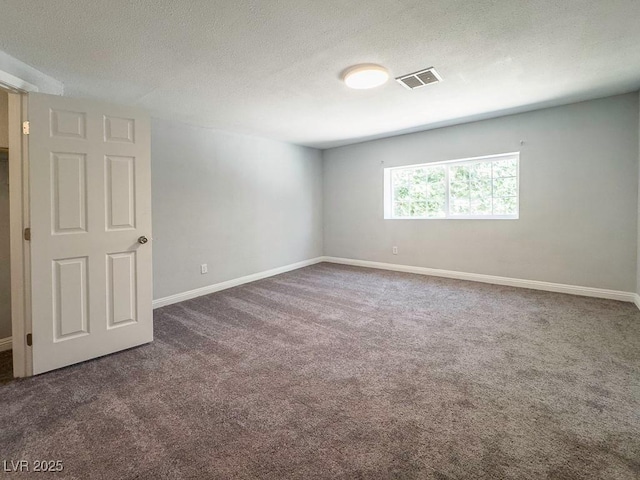 2713 Valley St, Las Vegas, NV 89101 - carpeted spare room featuring a textured ceiling and baseboards